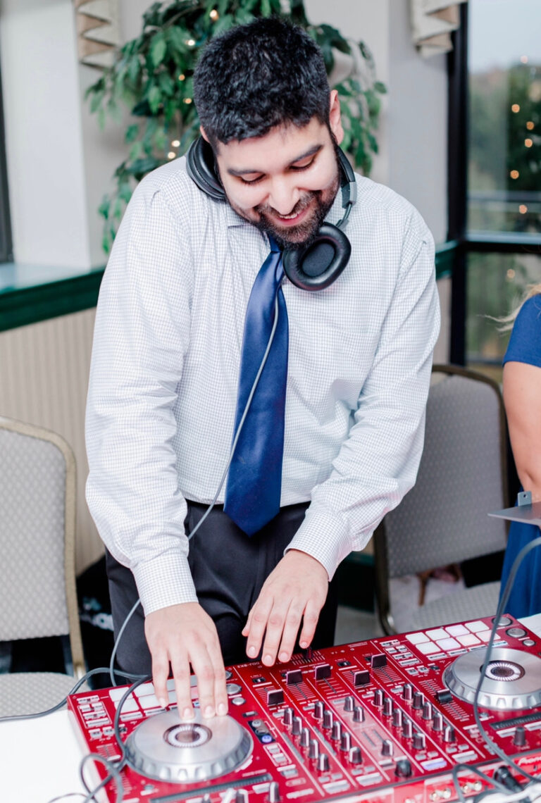 A man wearing headphones and a tie.