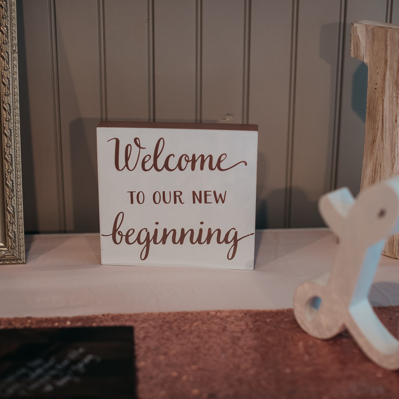 A sign that says welcome to our new beginning